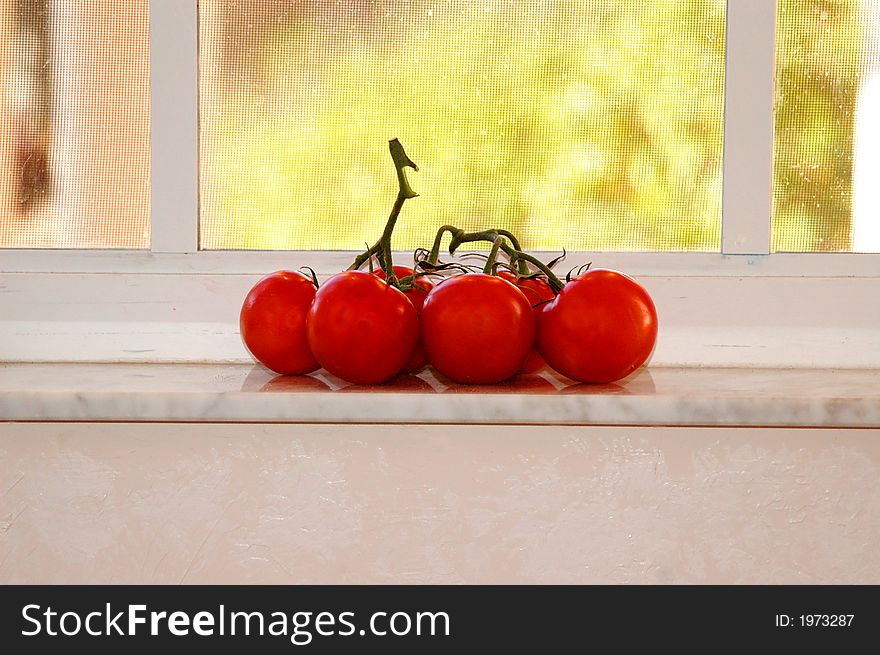 Tomatoes in window