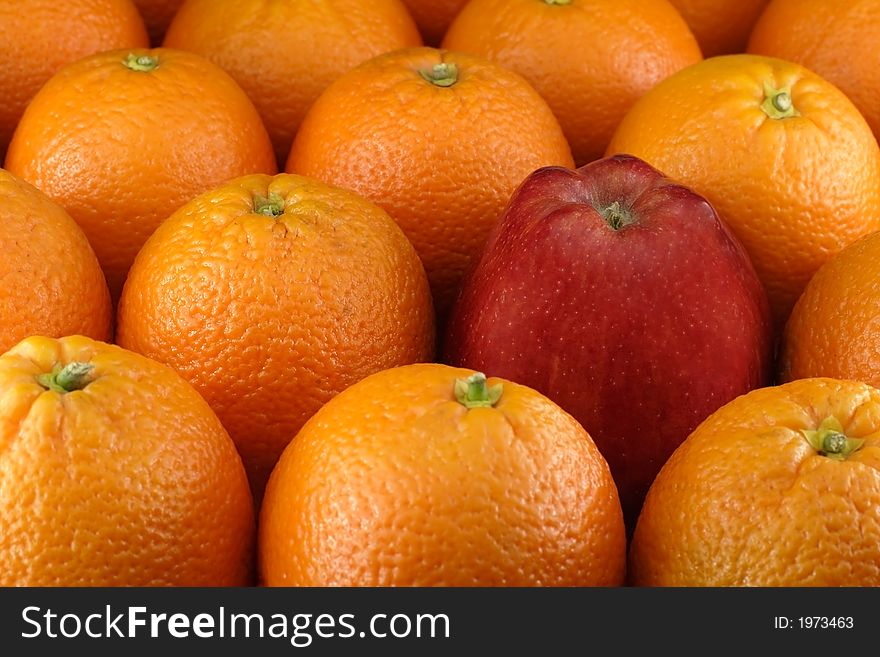 Apple between oranges