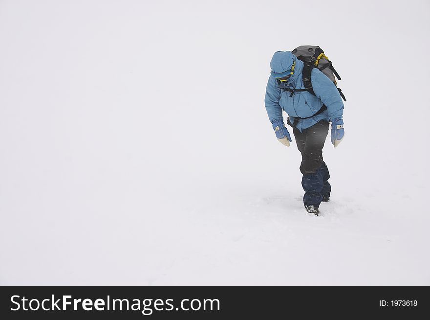 Mountaineer on bad winter weather (snow grain visible)