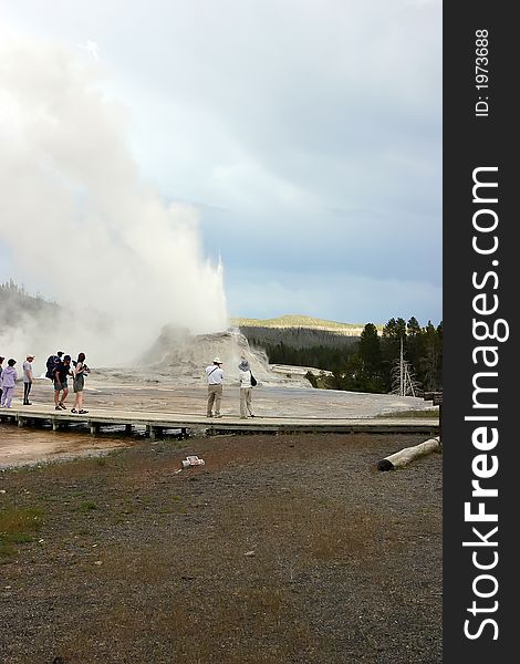 Erupting Geyser Near Tourists