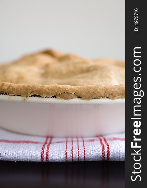 Fresh Baked apple Pie on a red and white kitchen towel
