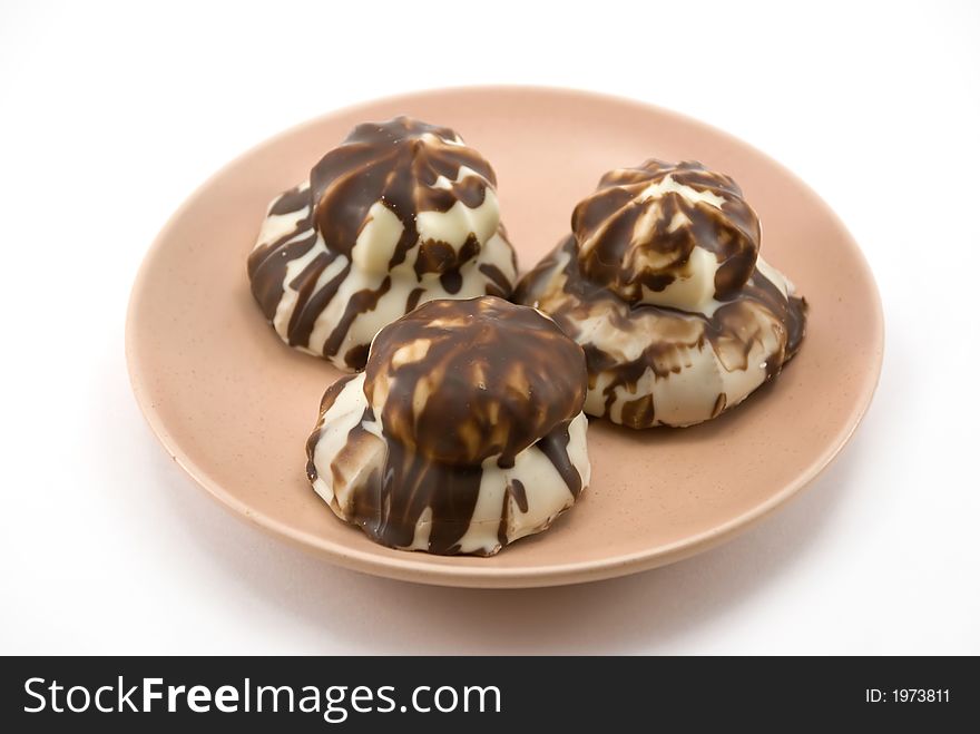Beautifully chocolate cookies on a plate on a white background