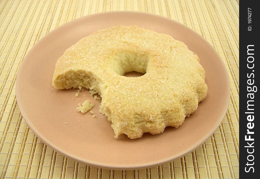 Beautiful sugar fruitcake and a plate on a bamboo napkin