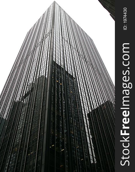 A Dark glass office tower with reflection. A Dark glass office tower with reflection