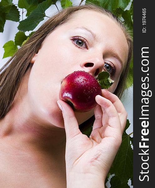 Beautiful young woman portrait with apple. Beautiful young woman portrait with apple