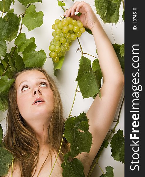 Beautiful young woman portrait with green grape. Beautiful young woman portrait with green grape