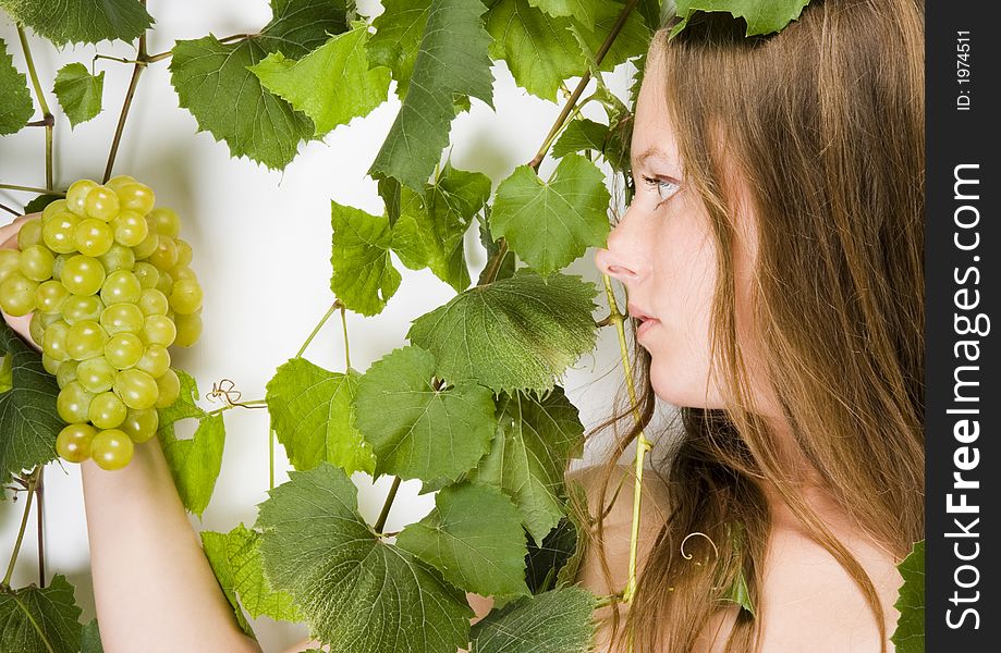 Beautiful young woman portrait with green grape. Beautiful young woman portrait with green grape