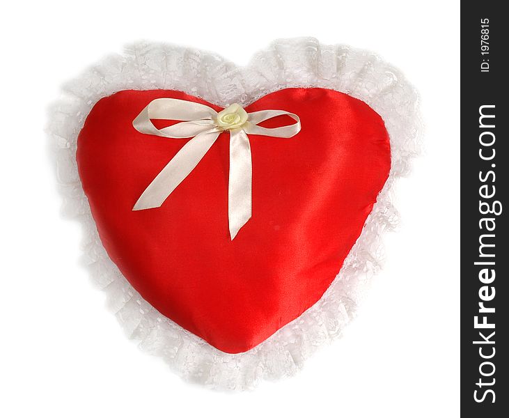 Red Pillow As A Heart On The Day Of Sainted Valentine On A White