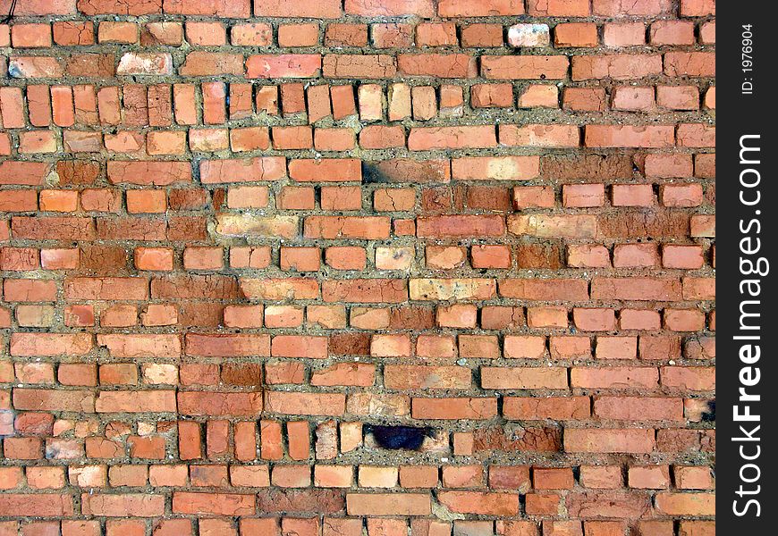 Aging wall from red brick...