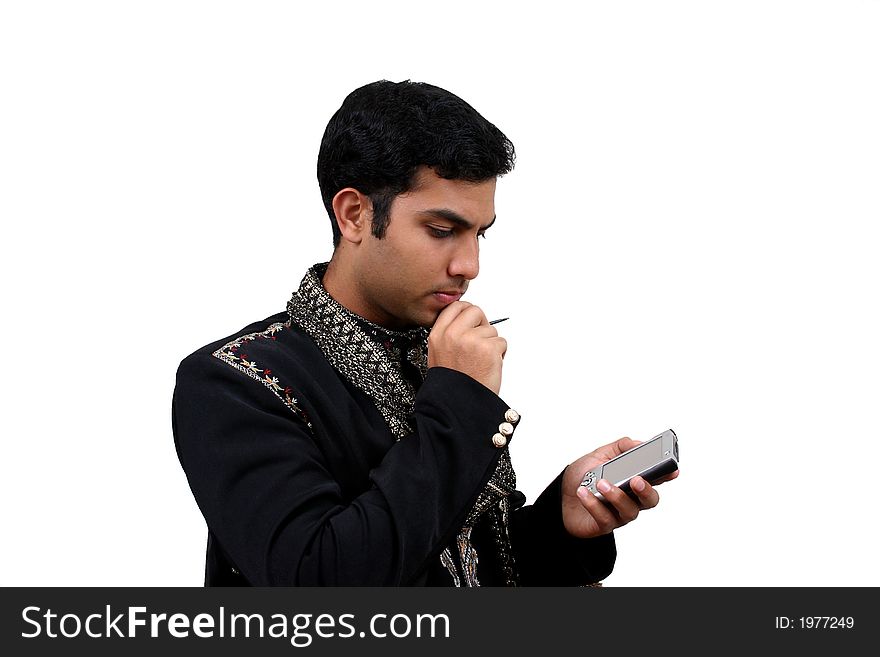 Indian in traditional clothes using pda (1) with clipping path. Indian in traditional clothes using pda (1) with clipping path