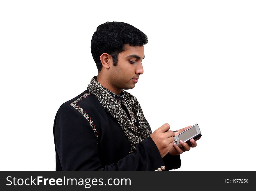 Indian in traditional clothes using pda (2) with clipping path. Indian in traditional clothes using pda (2) with clipping path