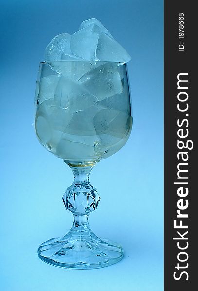 Ice and Glass of clean water in wineglass