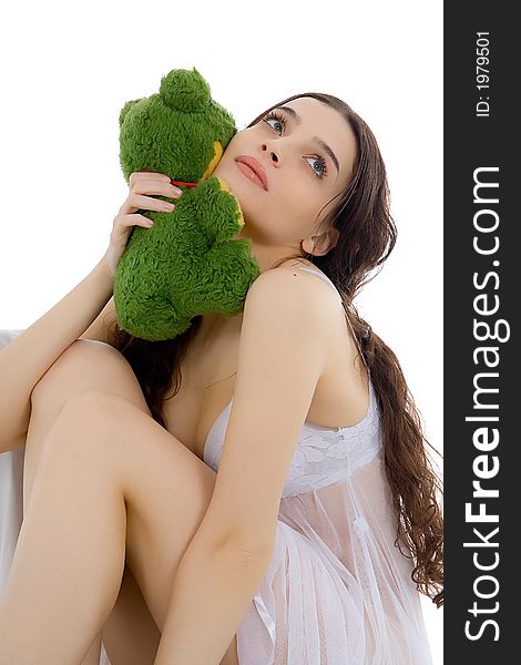 Beautiful girl holding her plush animal - against white. Beautiful girl holding her plush animal - against white