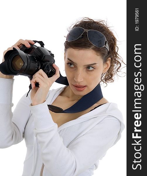 Attractive girl with camera against white background. Attractive girl with camera against white background