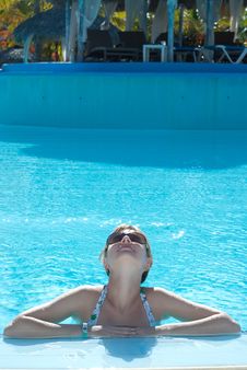 Young Woman In The Swimming Pool Royalty Free Stock Image