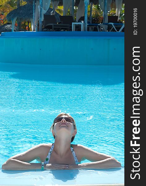 Young woman in the swimming pool