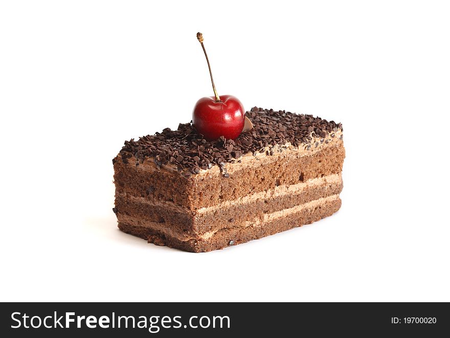 Cherry berry lying on a piece of freshness chocolate sponge cake