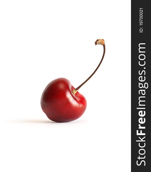 One cherry with stem on white background. Clipping path is included. One cherry with stem on white background. Clipping path is included