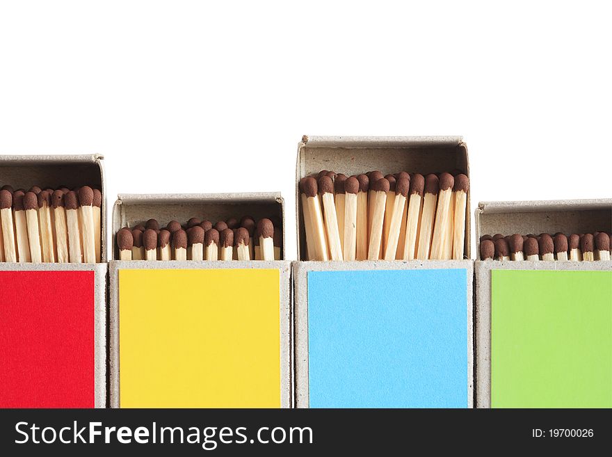 Closeup of few variegated matchboxes in a row on white background. Clipping path is included. Closeup of few variegated matchboxes in a row on white background. Clipping path is included