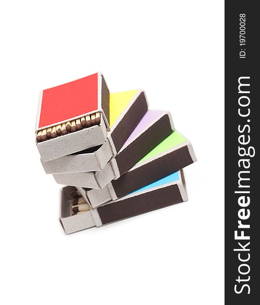 Stack of few open variegated matchboxes on white background. Stack of few open variegated matchboxes on white background
