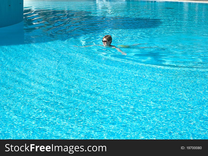 Young Woman In The Swimming Pool