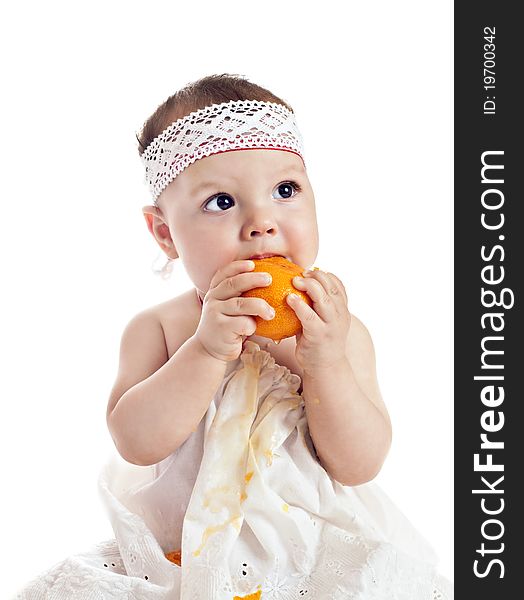 Baby girl with orange isolated on white