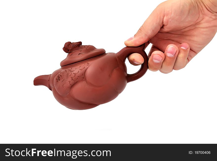 Brown ceramic teapot on a white background