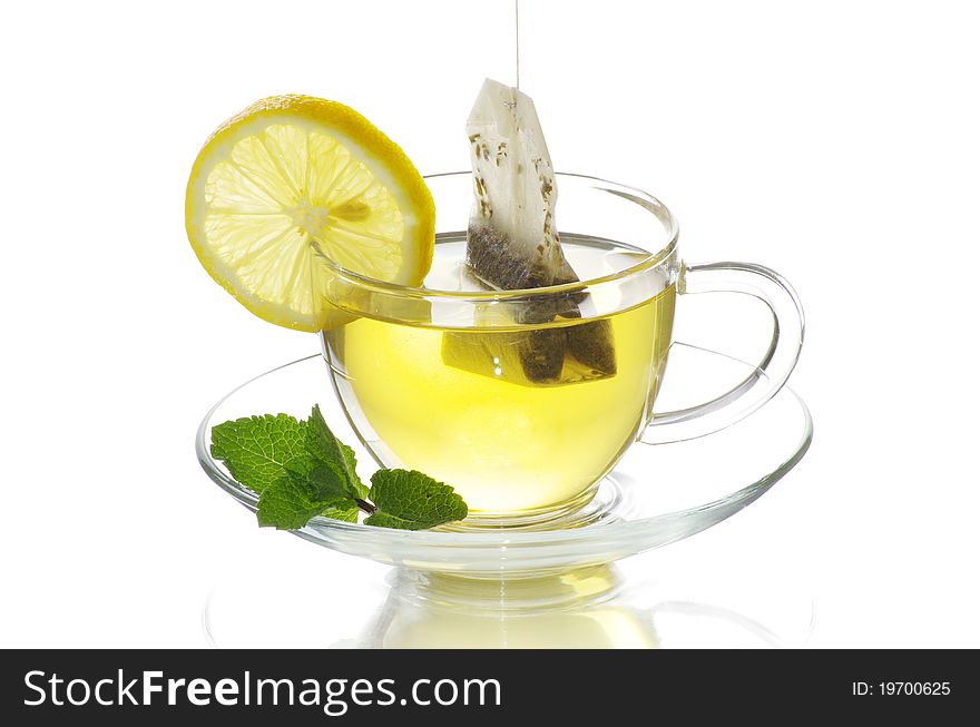 Tea in cup with leaf mint  isolated on white background