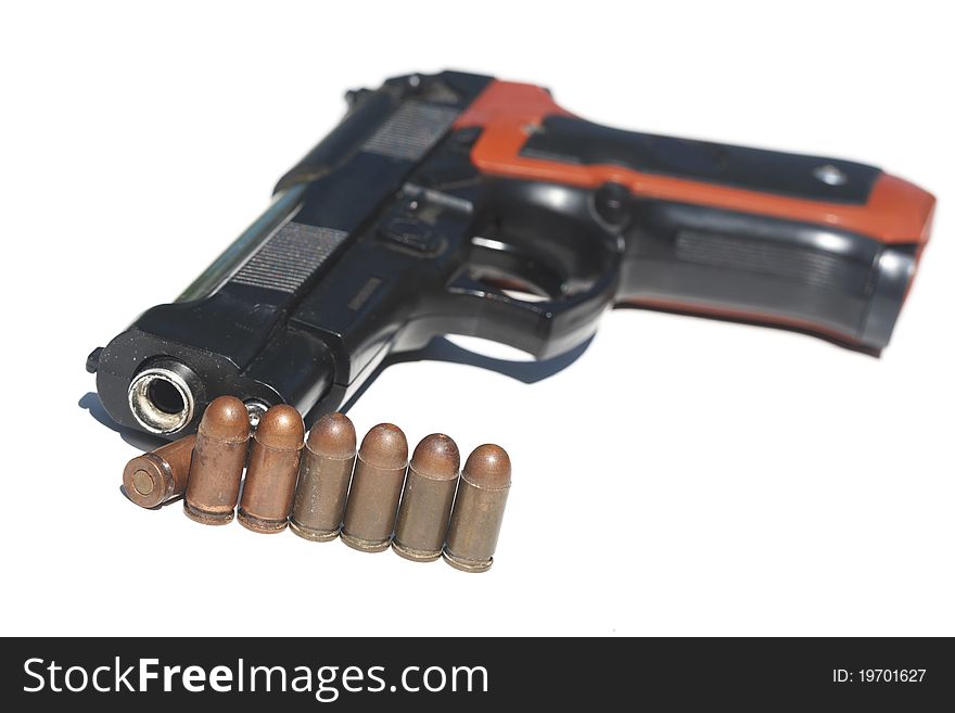 Pistol and ammunition on a white background