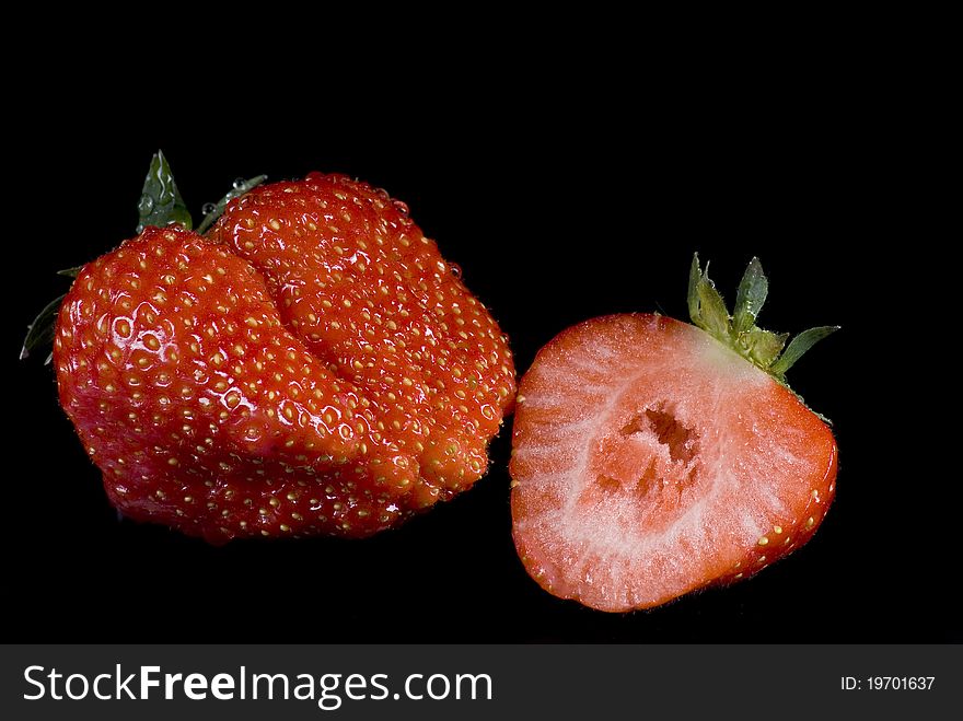 Strawberries on the black background