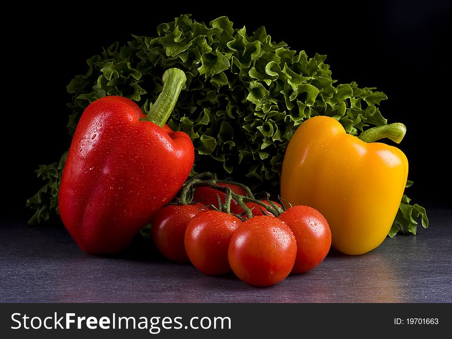 Fresh vegetables on a black background