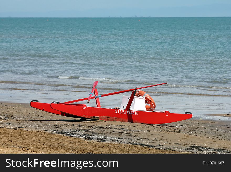 A red rowing boat for lifeguards at the beach