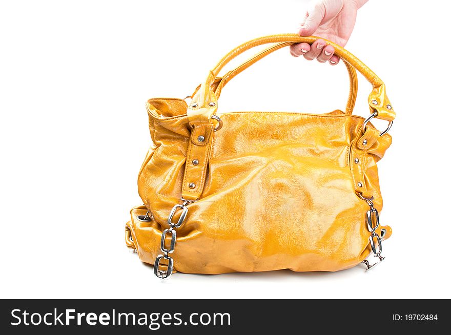 Fashion yellow bag isolated on a white background