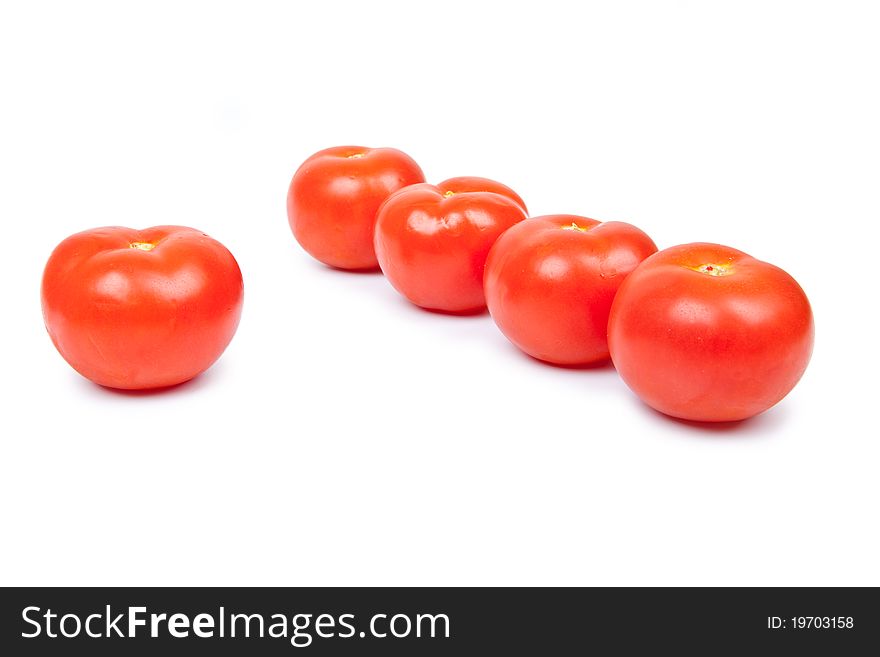 Some red tomatos in group isolated on white background