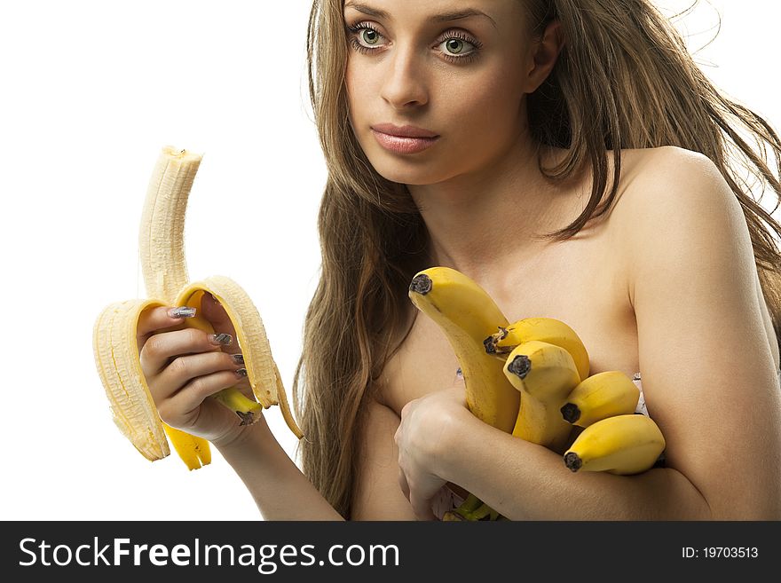 Beautiful young woman holding bananas - white background