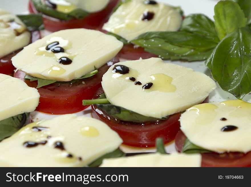 Tomatos, Mozzarella And Basil With Olive Oil.