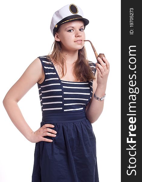 Girl in a sailor cap smoking a pipe on a white background