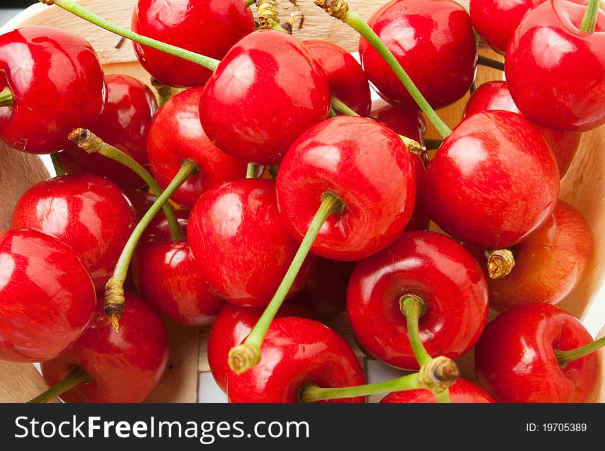 Bunch of cherries in a wooden basket
