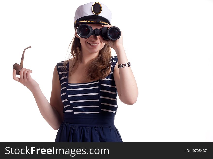 A girl in a sailor cap holding a pipe for smoking