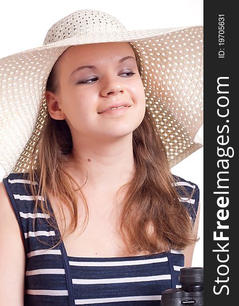 A girl in a big straw hat on a white background