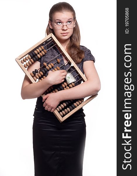 Girl with big wooden accounts and money on a white background