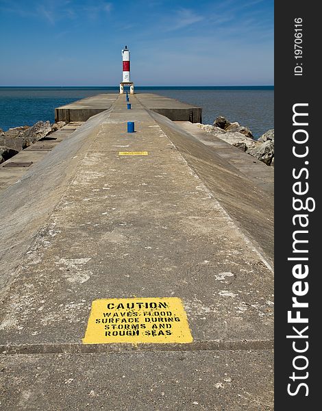 Caution sign on a cement pier. Caution sign on a cement pier