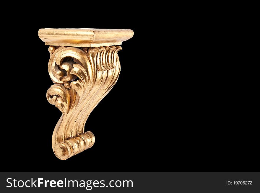 Hand-made golden pedestal isolated on black