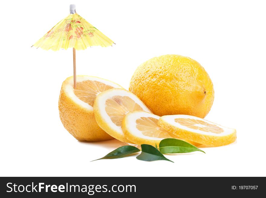 Fresh lemon and umbrella isolated on a white background