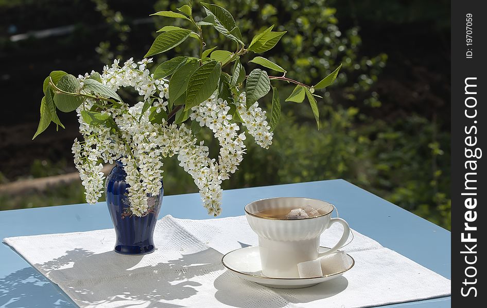 Cup Of Tea On Table In A Garden In The Spring