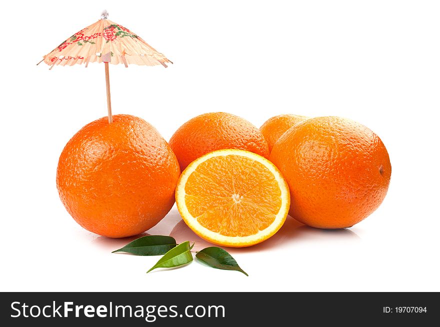 Fresh orange and umbrella isolated on a white background