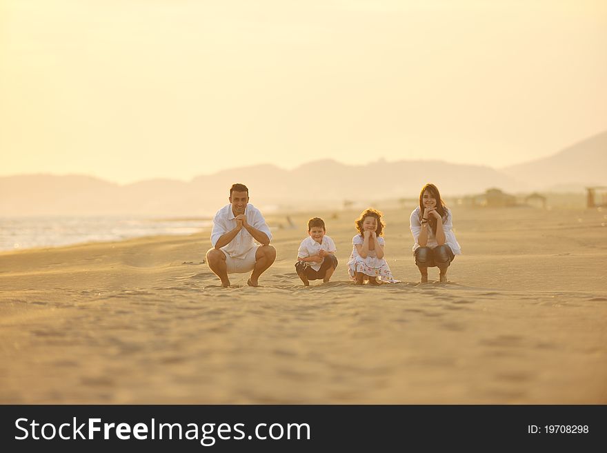 Happy young family have fun on beach