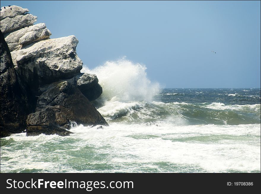 Waves crashing against Morro Rock near Morro Bay, CA. Waves crashing against Morro Rock near Morro Bay, CA