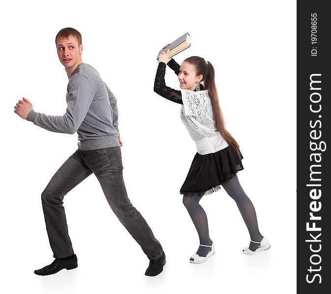 Girl with a book in her hands ran over boyfriend. Isolated on white background