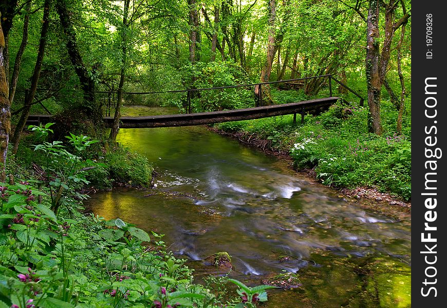 Small river flowing over small cascades